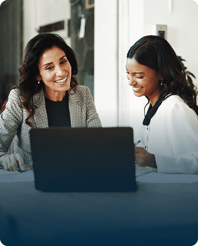 Colleagues smiling during a meeting